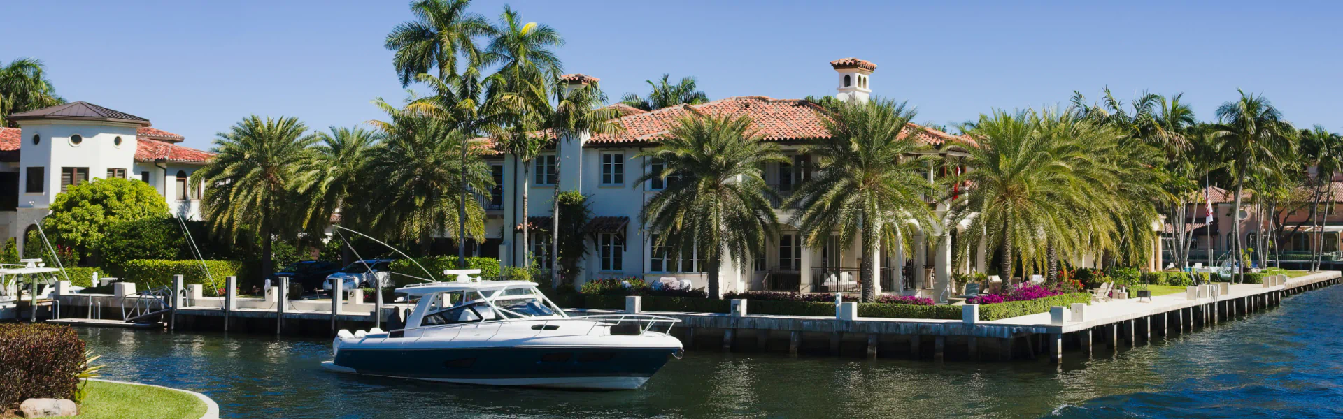luxurious residential house surrounded by water and small yacht cypress lake fl